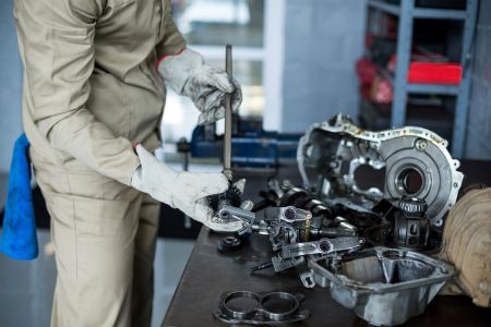 mechanic-checking-car-parts